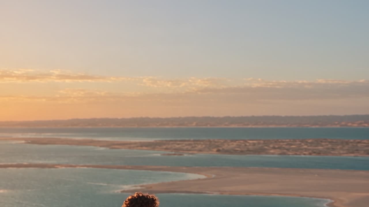 A scene from Mubadir’s film: siblings looking towards Qatar’s horizon